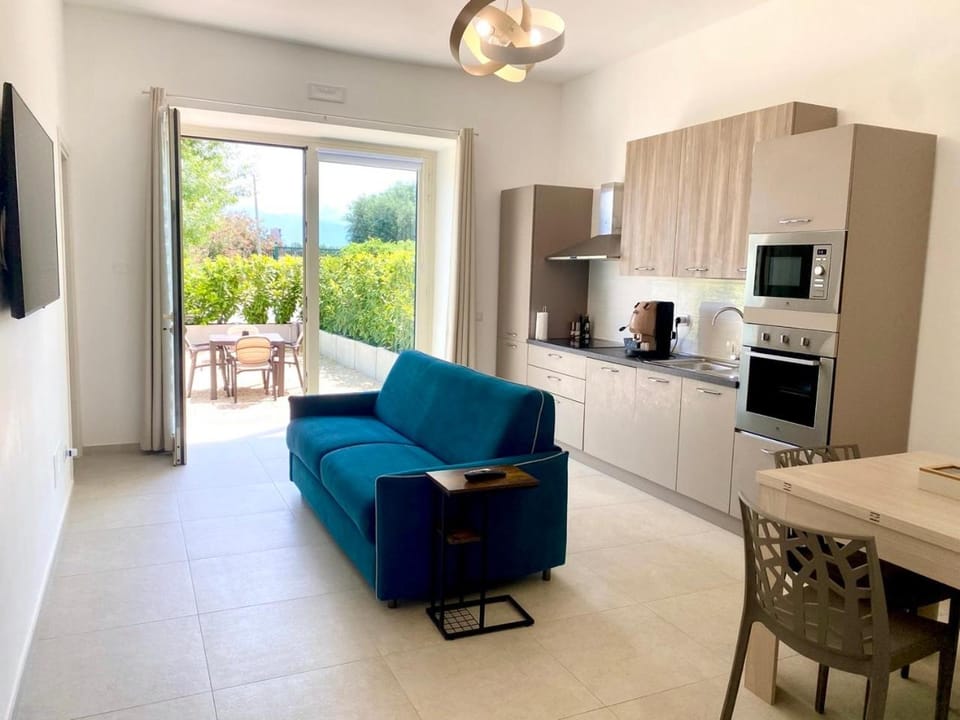 Kitchen or kitchenette, Living room, Seating area, Garden view, dishwasher, oven, stove, toaster