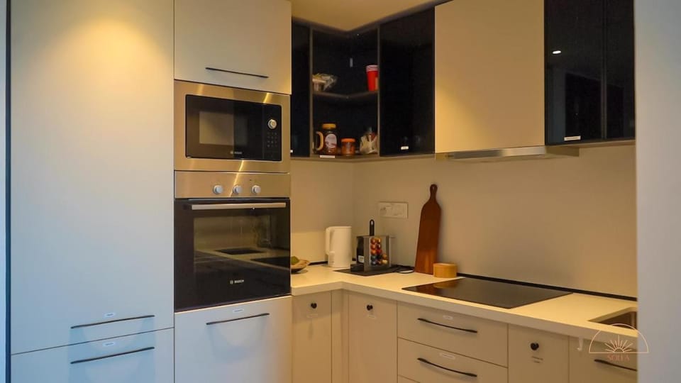 Kitchen or kitchenette, dishwasher, oven, stove