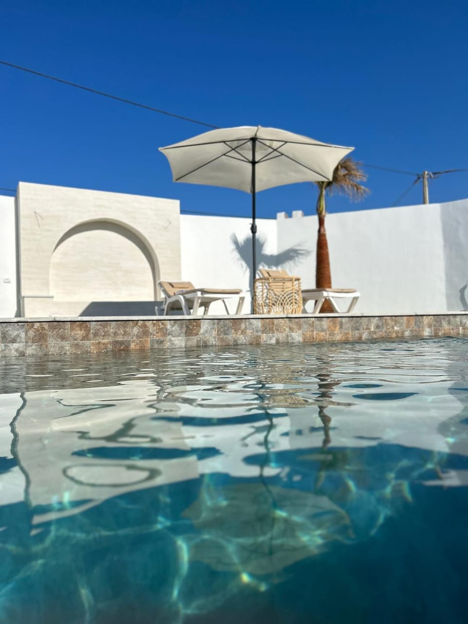 Patio, Day, Natural landscape, Pool view, Swimming pool, sunbed