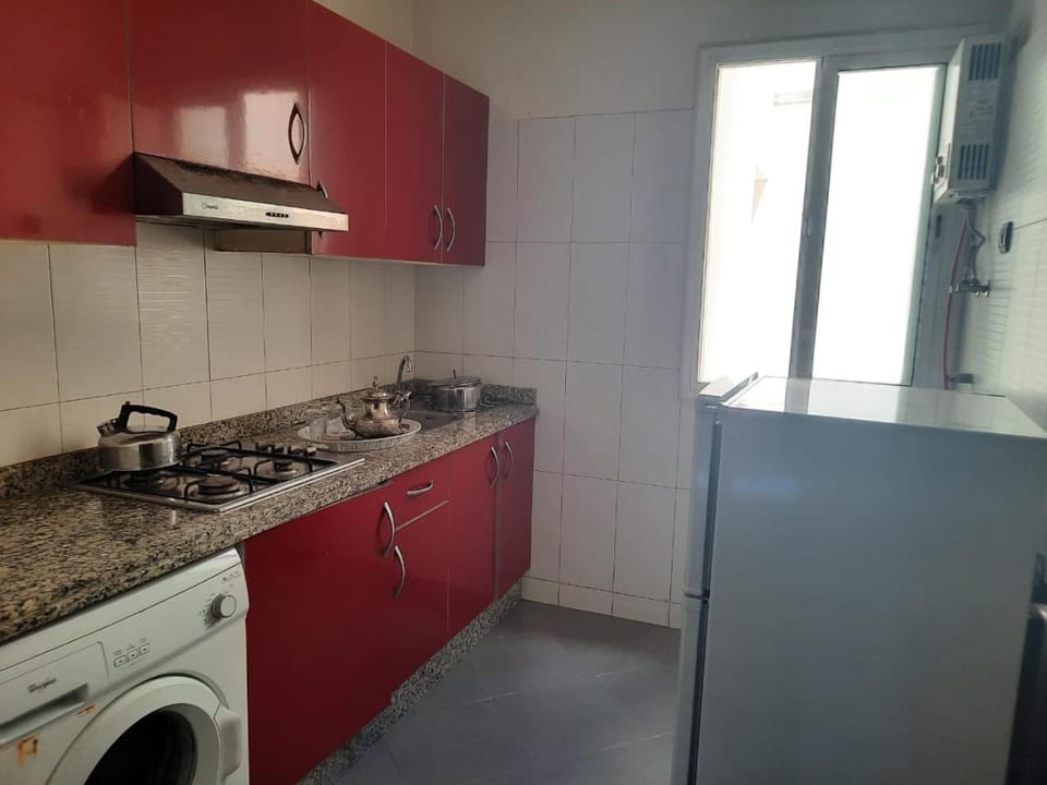 Kitchen or kitchenette, stove, washing machine