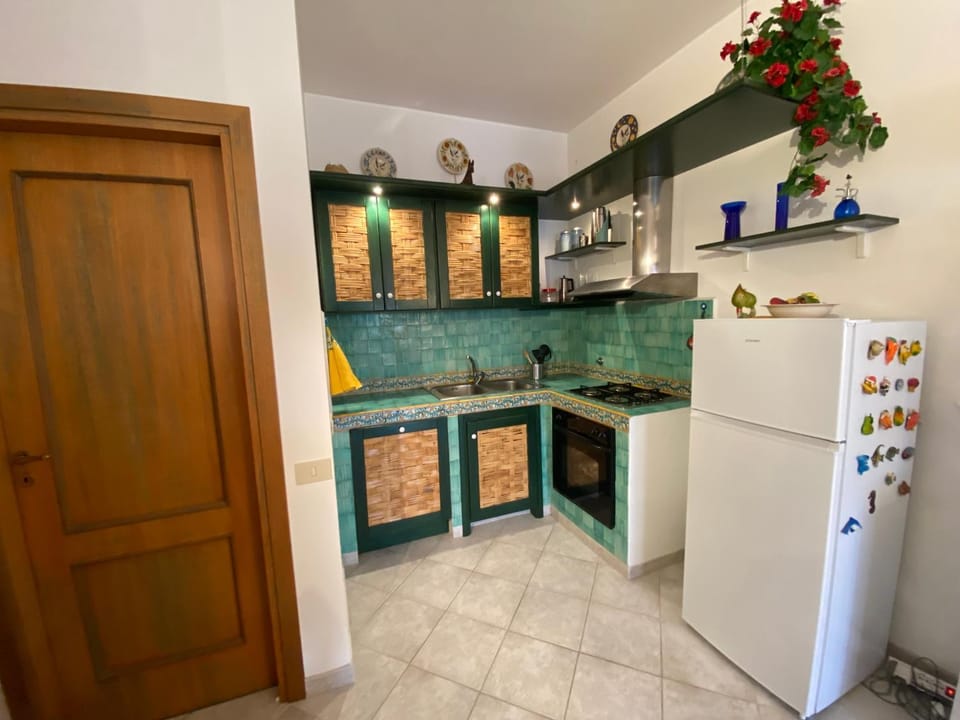 Kitchen or kitchenette, dishwasher, oven, stove