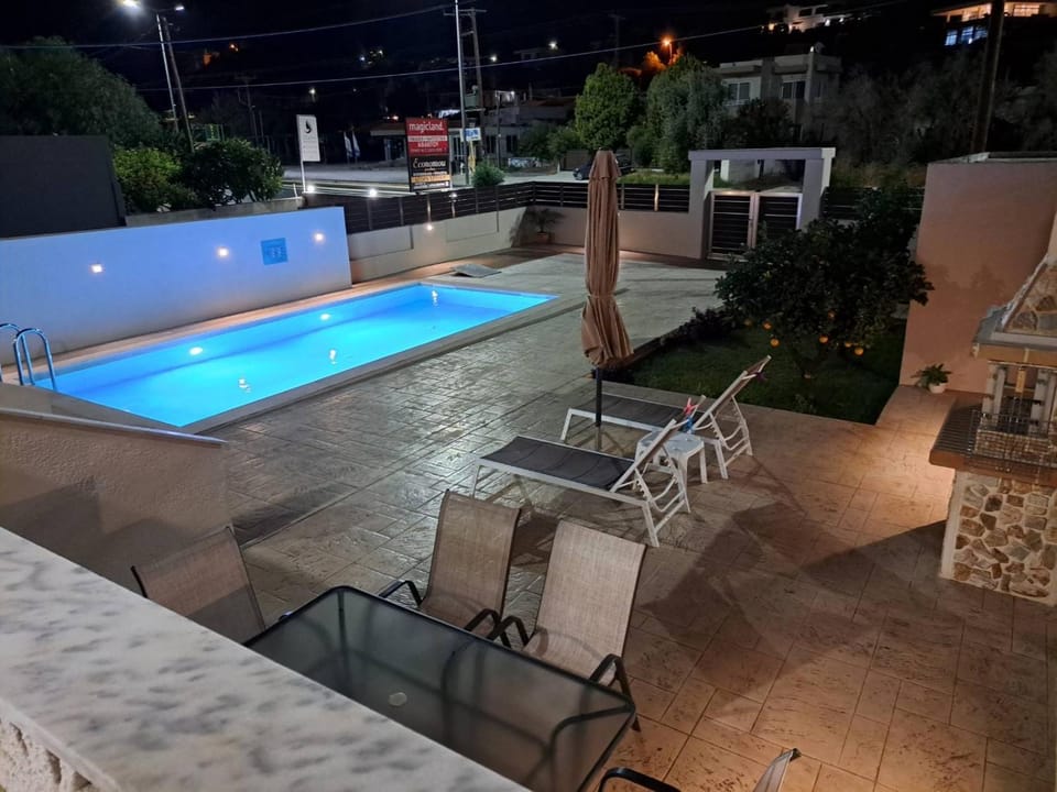 Patio, Night, Pool view, Swimming pool, sunbed