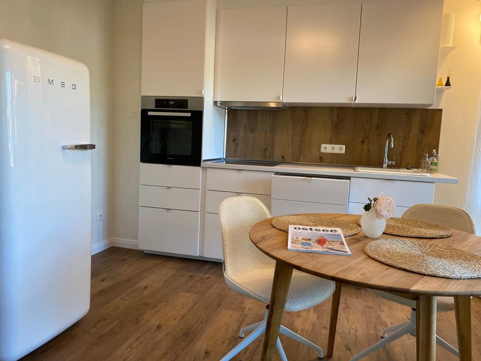 Kitchen or kitchenette, Dining area, dishwasher, furniture, minibar, stove, toaster