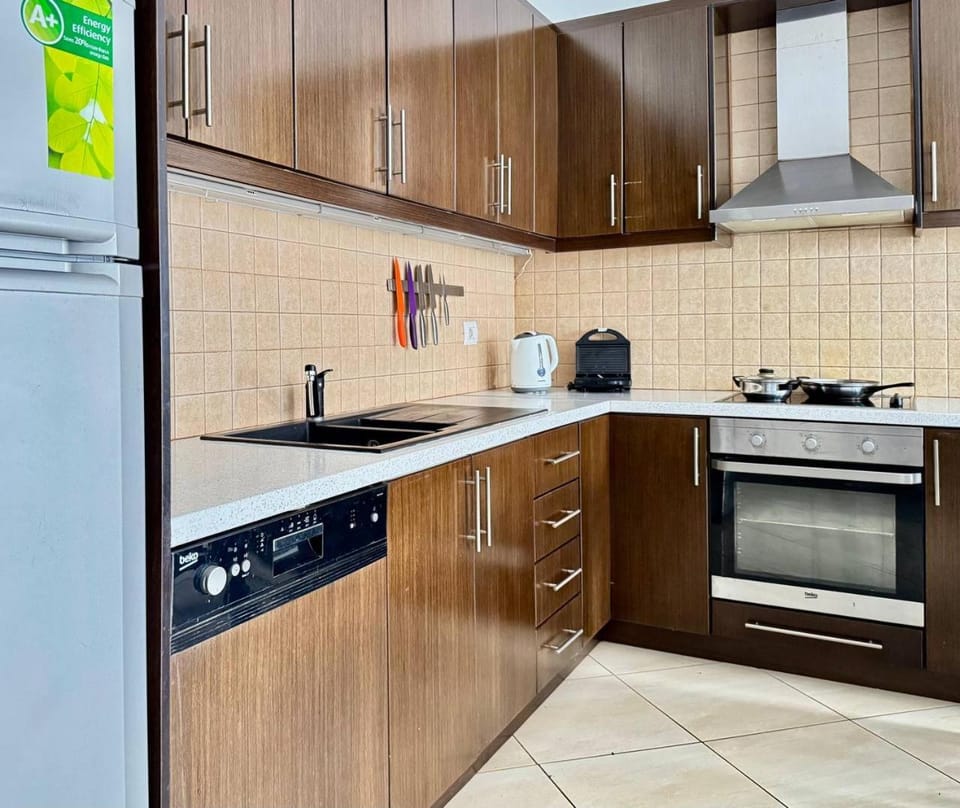 Kitchen or kitchenette, dishwasher, oven, stove, toaster