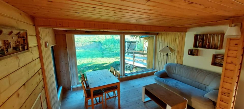 Communal lounge/ TV room, Natural landscape, Living room, Seating area, Dining area