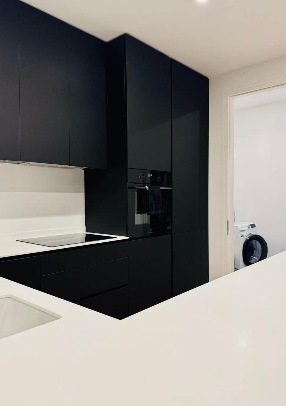 Kitchen or kitchenette, dishwasher, oven, washing machine