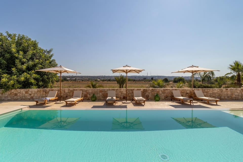 Patio, Day, Natural landscape, Pool view, Swimming pool, sunbed