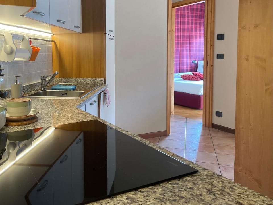 Kitchen or kitchenette, microwave, stove