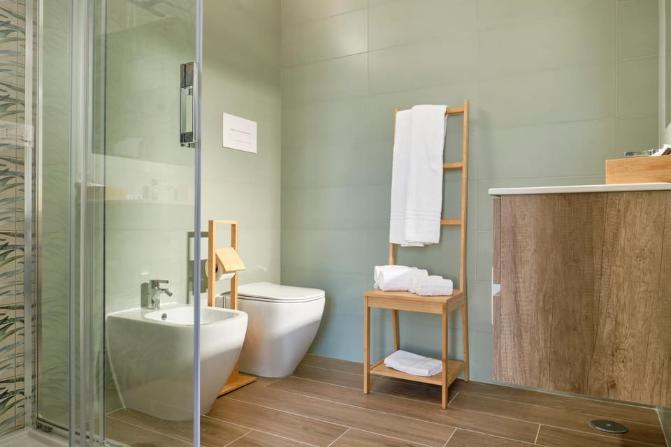 Shower, Toilet, Bathroom, bidet, hair dryier, towels