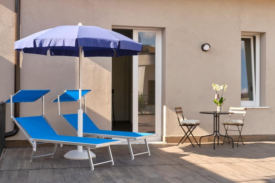 Property building, Day, Balcony/Terrace, Sunset, sunbed