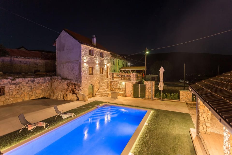 Property building, Patio, Night, Pool view, Swimming pool, sunbed