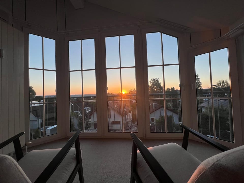 Natural landscape, View (from property/room), Living room, Seating area, Sunrise, Sunset