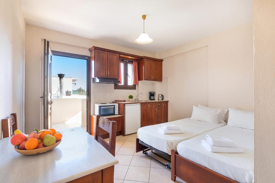 Bed, Kitchen or kitchenette, Seating area