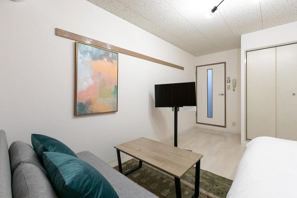 Bed, TV and multimedia, Living room, Seating area, wardrobe