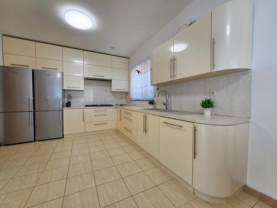 Kitchen or kitchenette, dishwasher, oven, stove
