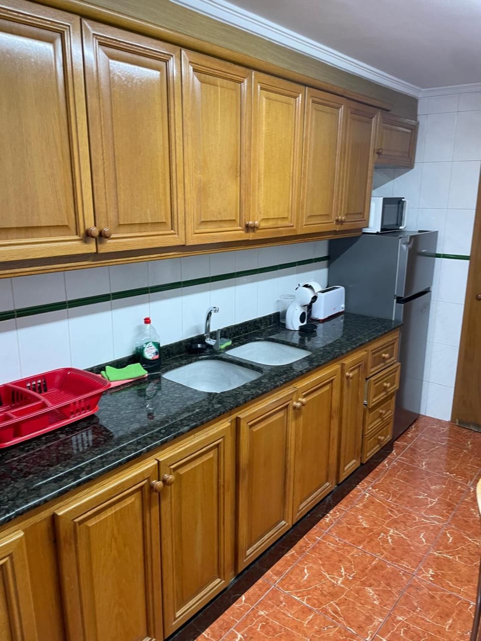 Kitchen or kitchenette, dishwasher, microwave, stove, toaster