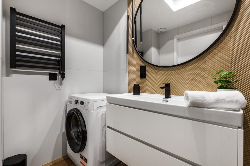 Shower, Bathroom, hair dryier, towels, washing machine