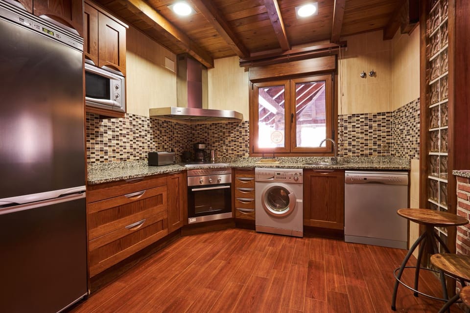 Kitchen or kitchenette, dishwasher, oven, stove, washing machine