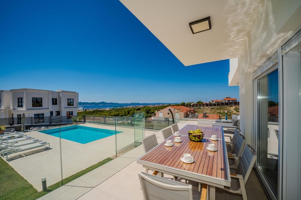 Patio, Day, View (from property/room), Dining area, Pool view, Sea view, Swimming pool, sunbed