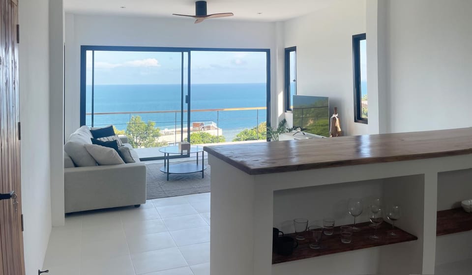 Natural landscape, View (from property/room), Balcony/Terrace, Kitchen or kitchenette, Living room, Seating area, Dining area, Sea view