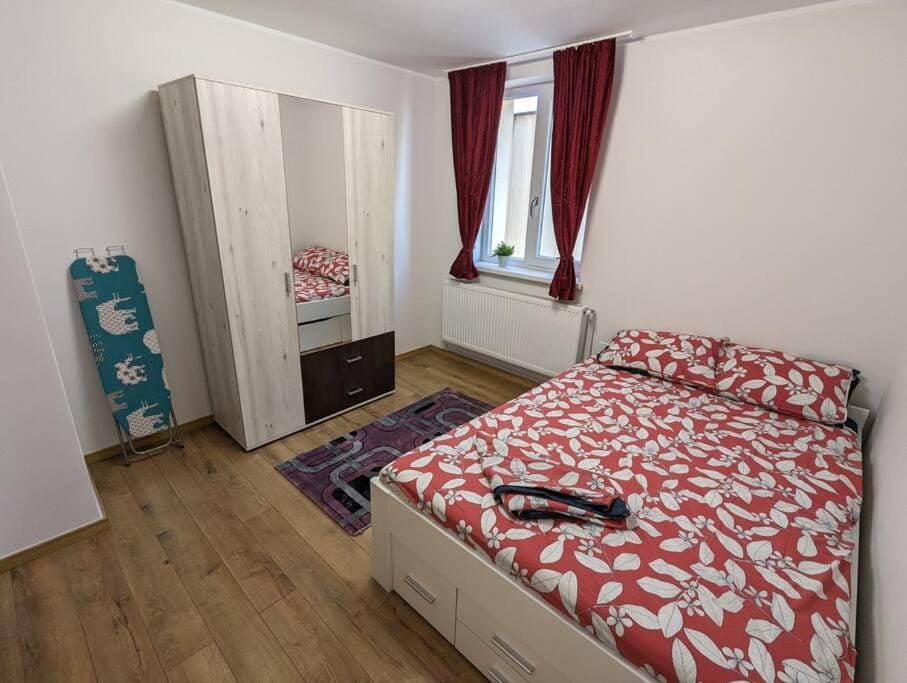 Bed, Photo of the whole room, Bedroom, flat iron, hair dryier, towels, wardrobe