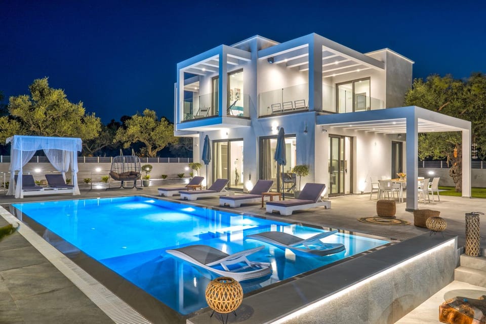 Property building, Patio, Night, Pool view, Swimming pool, sunbed