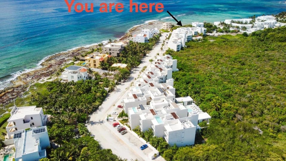 Property building, Nearby landmark, Day, Neighbourhood, Natural landscape, Bird's eye view, Beach, City view, Sea view, Street view, Location
