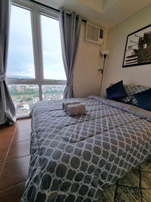 Bed, Photo of the whole room, Bedroom, towels, air conditioner