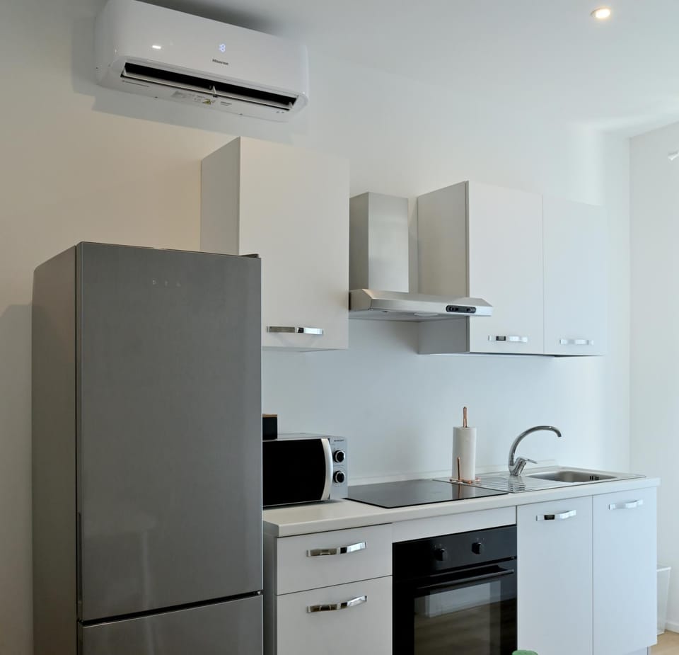 Kitchen or kitchenette, oven, stove, air conditioner