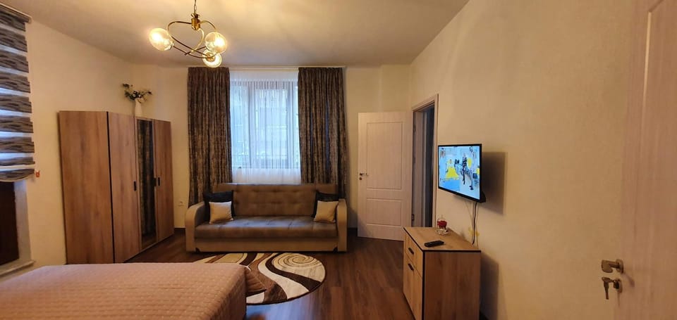 Bed, TV and multimedia, Seating area, Bedroom, hair dresser, wardrobe