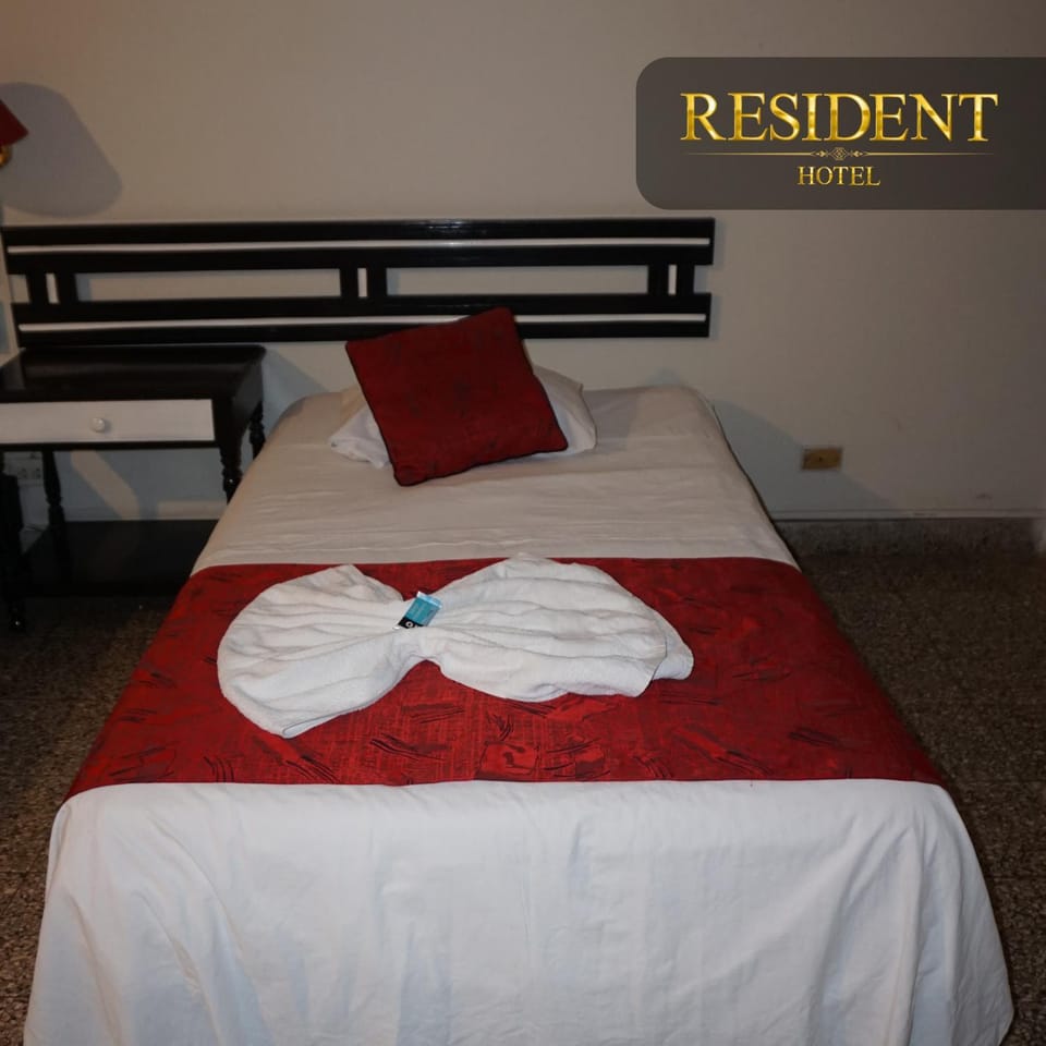 Bed, Photo of the whole room, Bedroom, Text overlay, towels