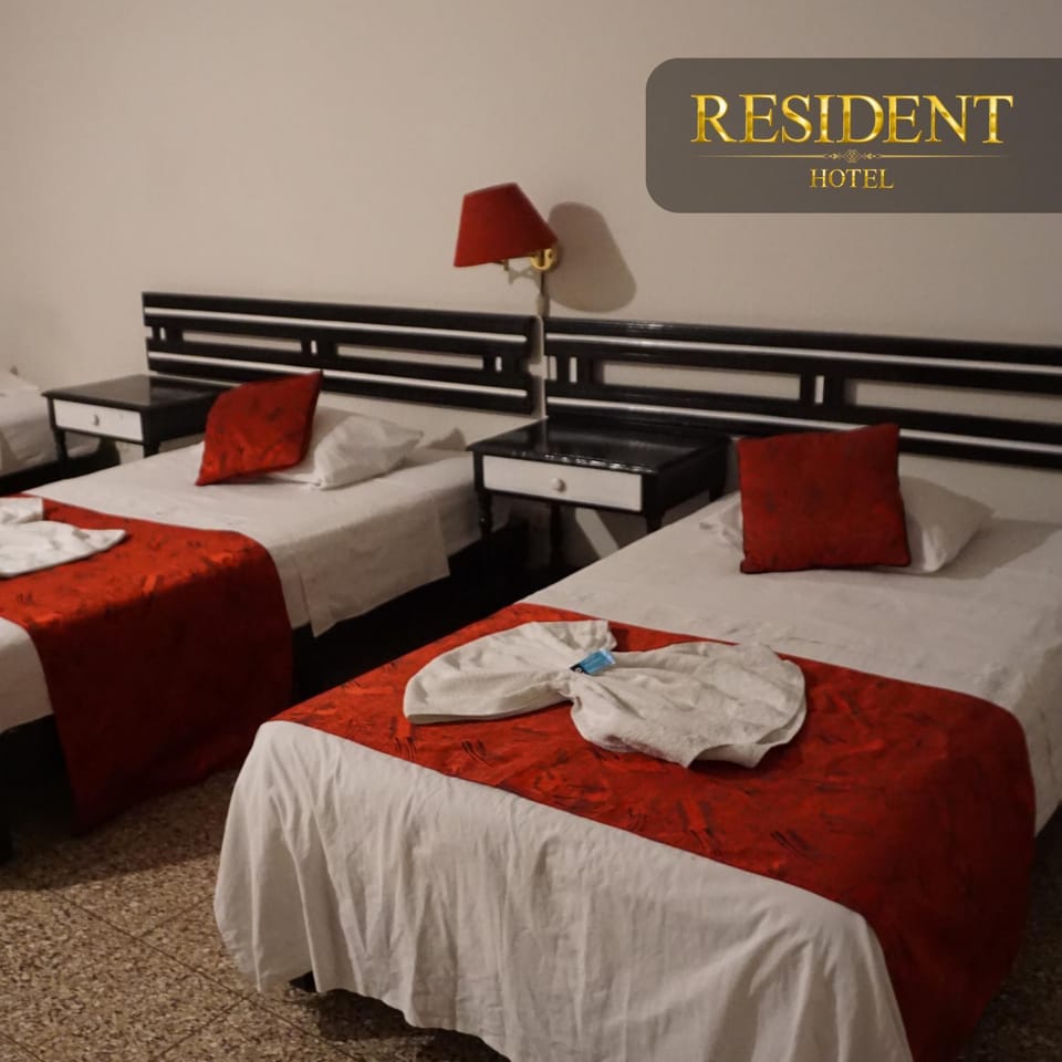 Bed, Photo of the whole room, Bedroom, Text overlay, towels