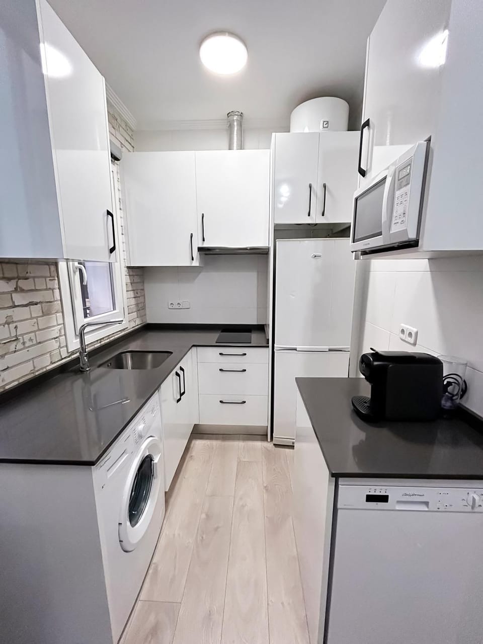 Kitchen or kitchenette, dishwasher, stove, toaster