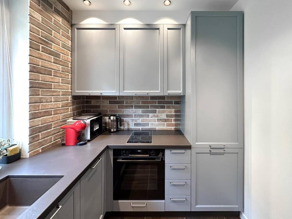 Kitchen or kitchenette, dishwasher, microwave, oven, toaster