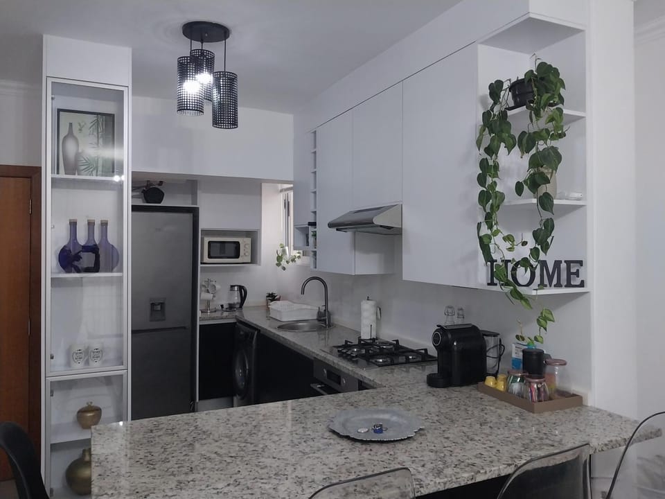 Kitchen or kitchenette, dishwasher, oven, stove, toaster