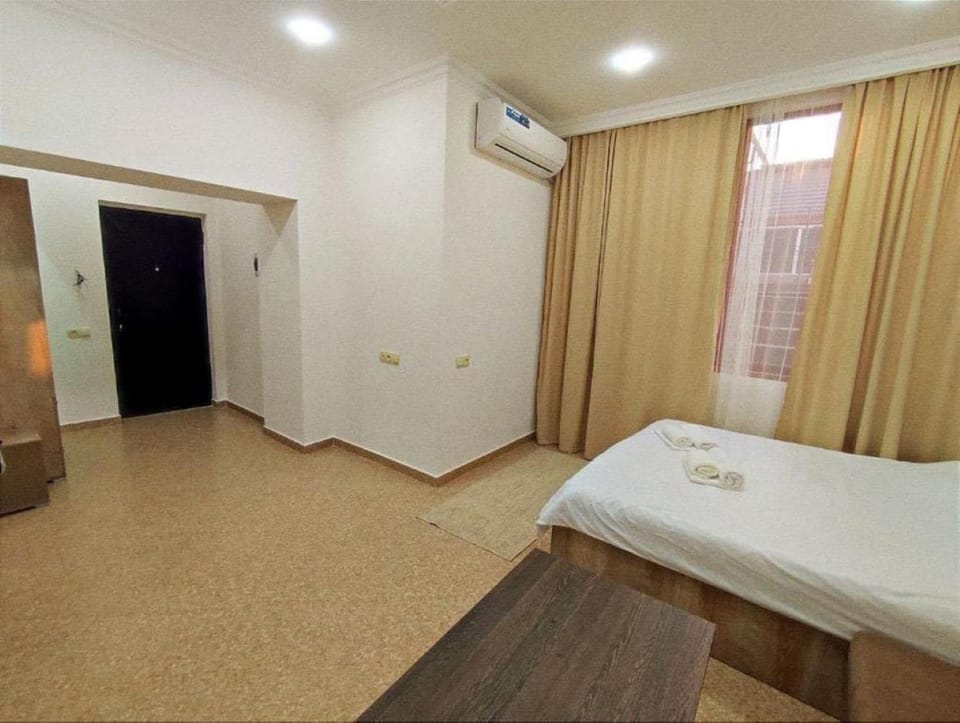 Bed, Photo of the whole room, Bedroom, towels, air conditioner