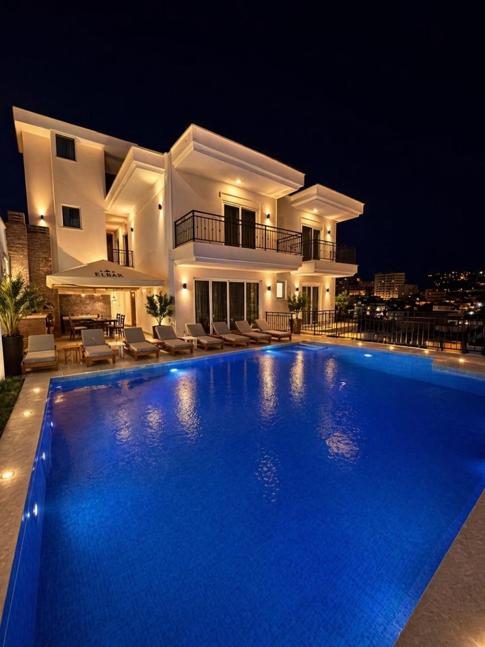 Property building, Patio, Night, Pool view, Swimming pool, sunbed