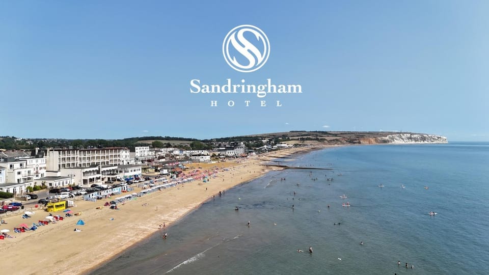 Property building, Nearby landmark, Day, Property logo or sign, Natural landscape, Bird's eye view, Beach, Logo/Certificate/Sign, Sea view