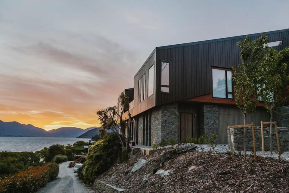 Property building, Facade/entrance, Lake view, Mountain view, Sunset