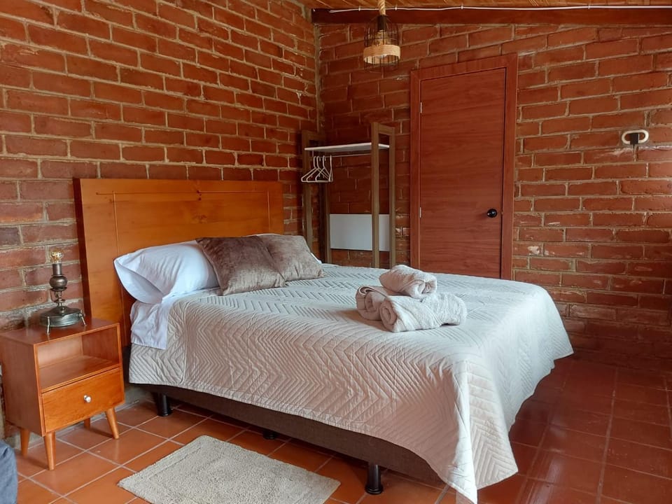 Bed, towels, wardrobe