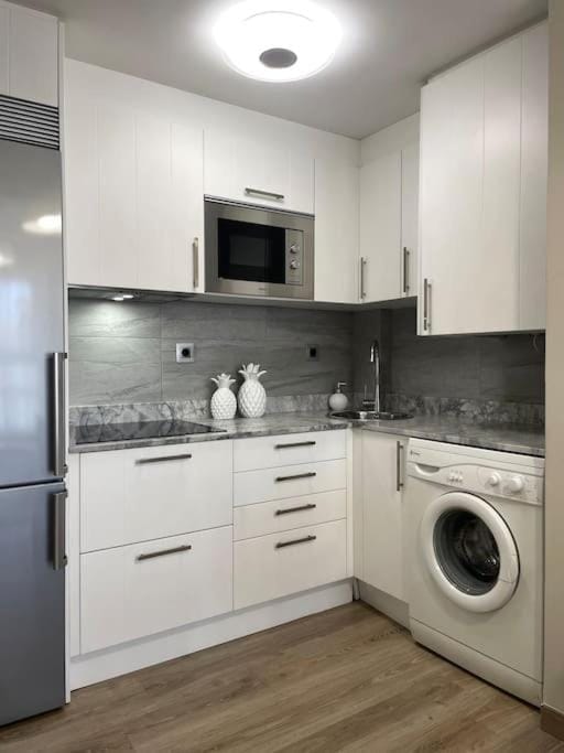 Kitchen or kitchenette, stove, washing machine