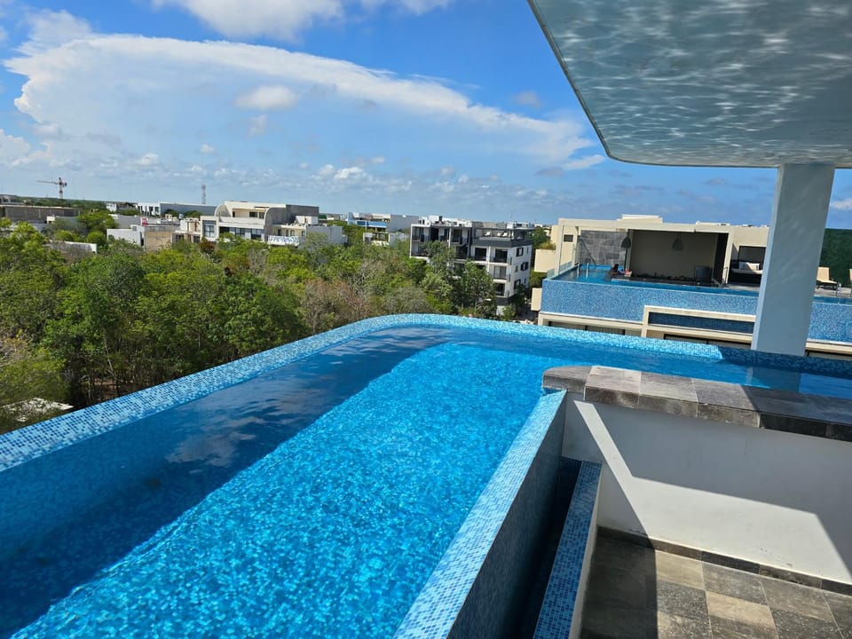 Property building, Day, Natural landscape, Balcony/Terrace, Pool view, Swimming pool