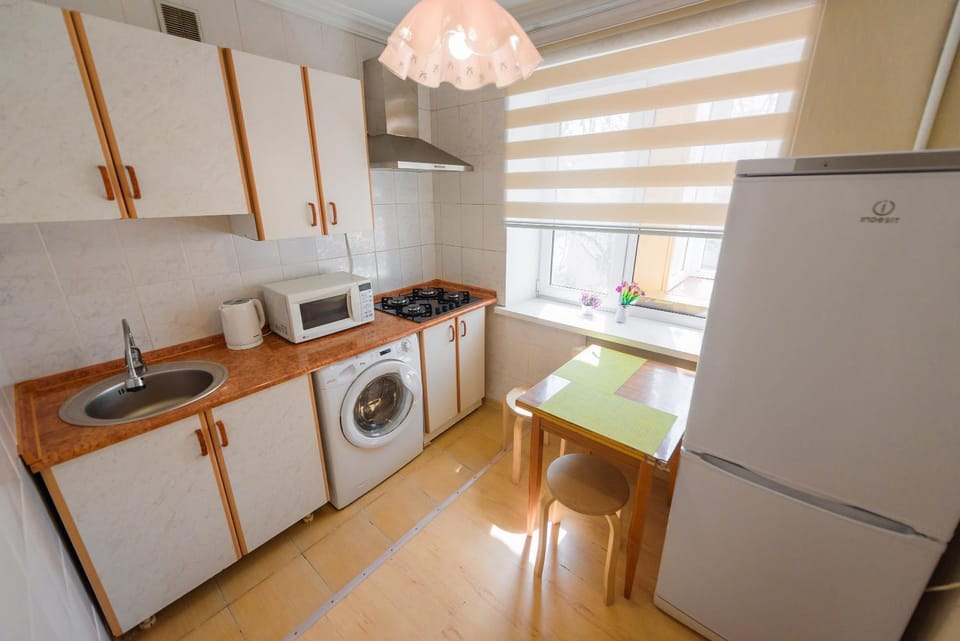 Kitchen or kitchenette, stove, washing machine