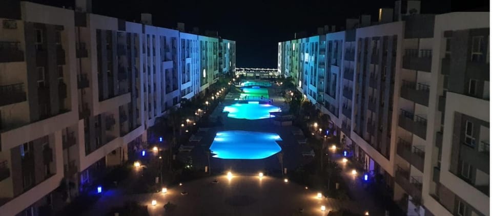 Property building, Night, View (from property/room), Pool view, Swimming pool