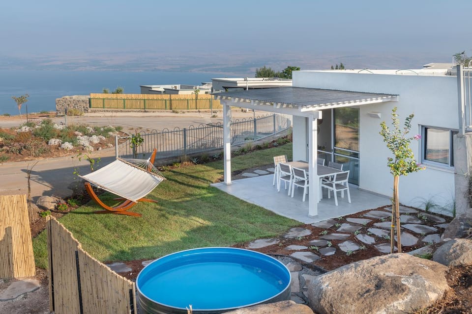 Property building, Patio, Natural landscape, Lake view, Sea view, Swimming pool
