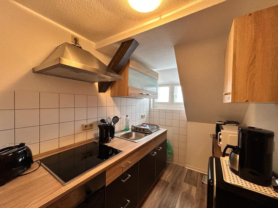 Kitchen or kitchenette, stove, toaster