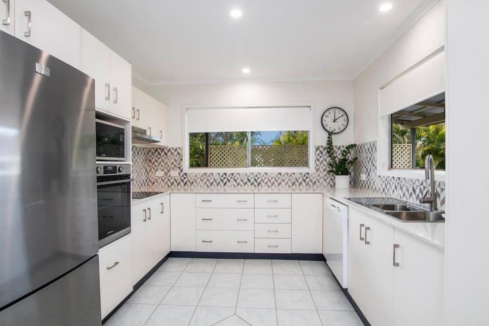 Kitchen or kitchenette, dishwasher, oven, stove