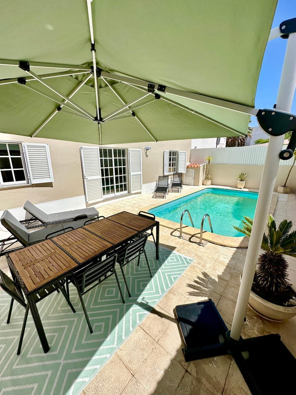 Property building, Patio, Swimming pool, sunbed