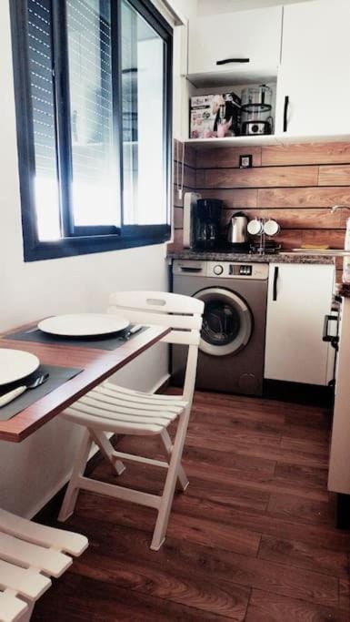 Kitchen or kitchenette, stove, washing machine