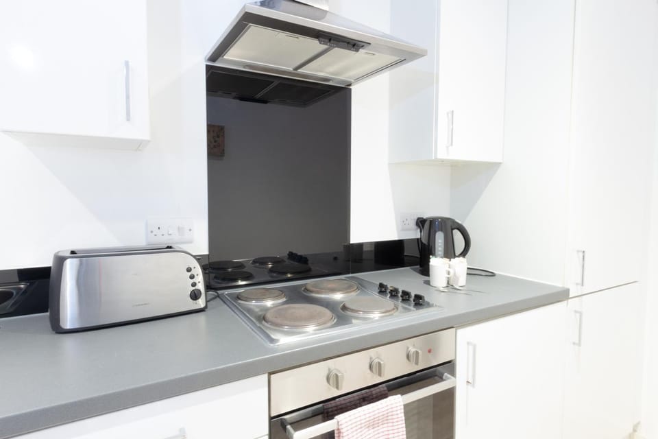 Kitchen or kitchenette, stove, toaster
